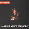 Dark suit and white cowboy hat